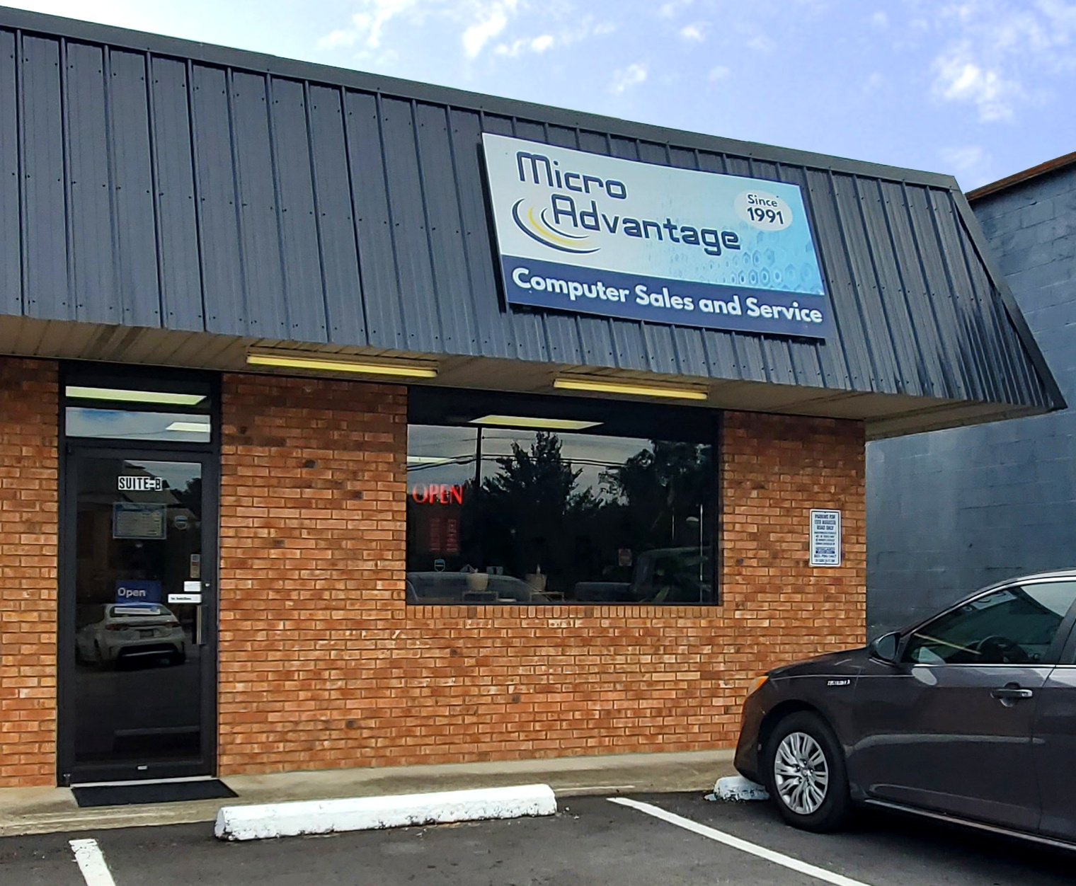 Storefront image showing Micro Advantage sign and Logo